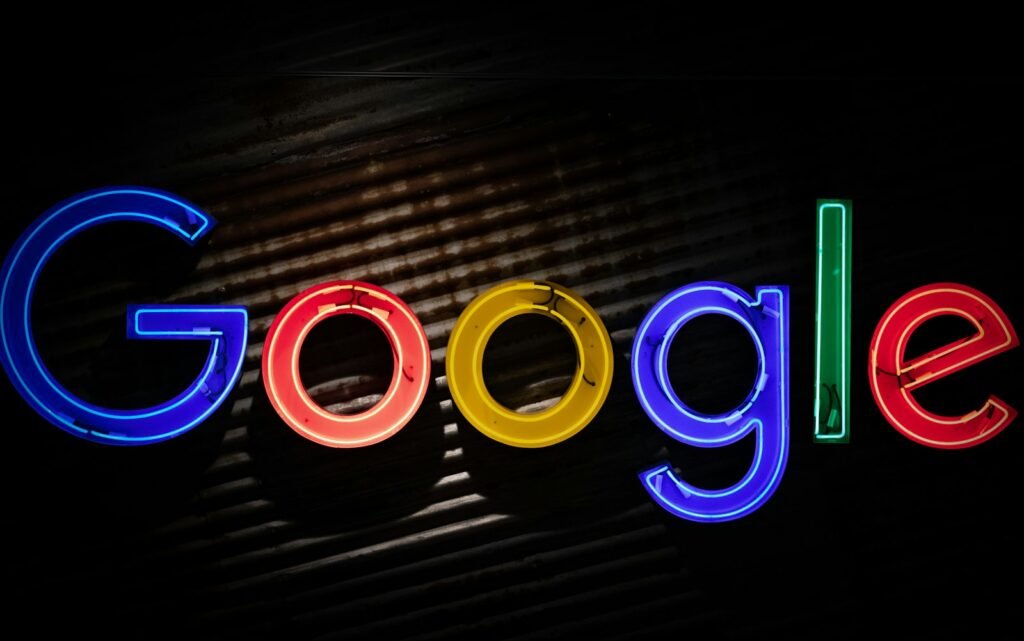 Neon Google sign on a dark wall